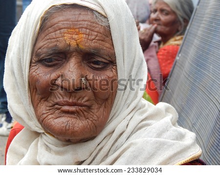 HYDERABAD,INDIA-JULY 21: Portriat of Indian woman begging on a busy road in Hyderabad,India on July 21,2014.