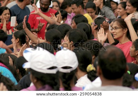 HYDERABAD,INDIA-MARCH 8:People watching zumba dancer show the fitness program during happy roads day on March 8,2015 in Hyderabad,India.
