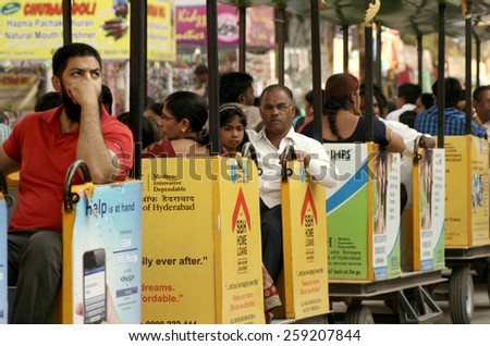 HYDERABAD,INDIA-JANUARY 18:Indian visitors ,enjoy the toy train, to numaish annual consumer exhibition happening since  1938 on January 18,2015 in Hyderabad,India.Happens for 46 days in 23 acre venue.