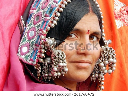 HYDERABAD,INDIA-MARCH 3:Closeup portrait of an Indian banjara woman with silver ornaments and colorful dress on March 3,2015 in Hyderabad,telangana,india.