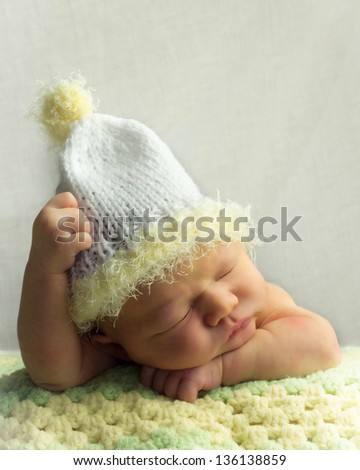 Newborn With Cap Sleeping