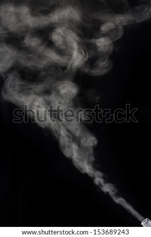 White smoke, vapor, or diffused oil on a black background