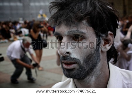 BOLOGNA, ITALY - JUN 18: A man masked as Zombie staring into space during the 'Partòt' Street Parade 2011 in 'Piazza Maggiore' Bologna, Italy on Jun 18, 2011.