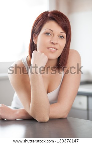 Woman thinking about the Future Indoor in the Kitchen