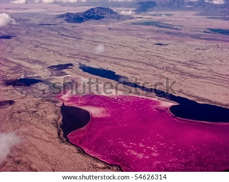 Saline lake Magadi in the Kenya Rift Valley, during the dry season, it is 80% covered by soda and is well known for its wading birds, including flamingos.