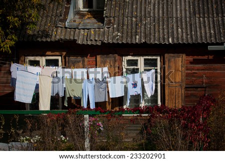 Vilnius, Lithuania - October 11, 2014: Laundry is hung to dry on the yard of old wooden house in Snipiskes district on October 11, 2014 in Vilnius, Lithuania.