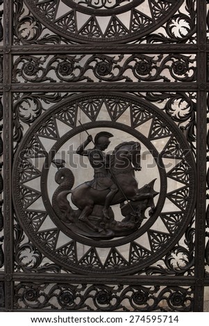 Saint George and the Dragon. Detail from one of the gates of the Marble Arch in London, United Kingdom