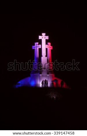 Vilnius, Lithuania - November 14, 2015: Three Crosses monument was illuminated in the French national colors last night after the terror attacks in Paris on 14 Nov, 2015 in Vilnius, Lithuania.