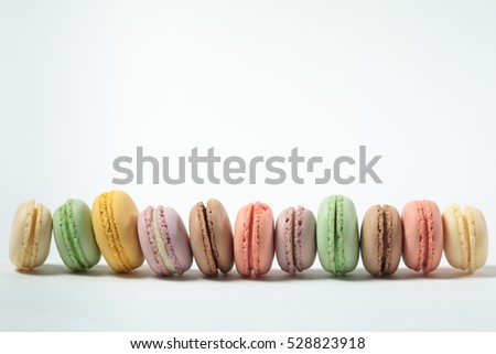 Sweet and colourful french macaroons, macaron on white background, pastel color, french cuisine