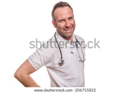 Handsome confident male doctor or nurse standing in a white shirt with a stethoscope around his neck isolated on white