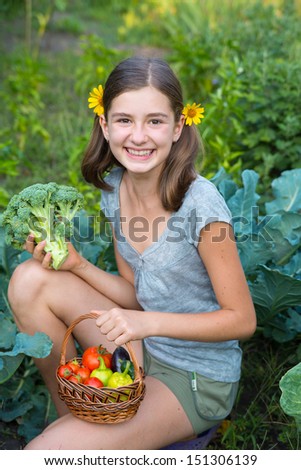 Girl with basket vegetables. Girl harvests