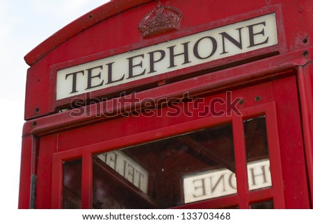 Closeup of red vintage telephone kiosk