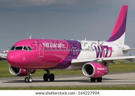 PRAGUE - SEPTEMBER 9: A320 Wizz Air taxi for takeoff for PRG in Prague, CZE on September 9, 2010. Wizz Air is a Hungarian low-cost airline.