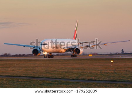 PRAGUE, CZECH REPUBLIC - JANUARY 07: Boeing 777-300 Emirates taxis for take offl in PRG Airport on January 07, 2014. Emirates is an airline based in Dubai.