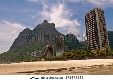 Beautiful Tropical Beach Landscape, Mountains, Luxury Buildings in Sao Conrado Beach, Rio de Janeiro, Brazil