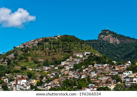 Rio de Janeiro Mountains with Slums and Corcovado with Christ the Redeemer statue.