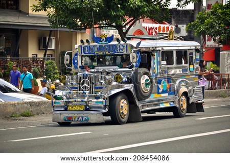 ANGELES CITY, PHILIPPINES - OCTOBER 9: Jeepney on the street on October 9, 2012 in Angeles City, Philippines. Jeepneys are the most popular means of public transportation in the Philippines.