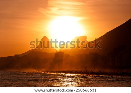 Scenic View of Sunset in Copacabana Beach, Sun Goes Down Behind Mountains, Rio de Janeiro, Brazil