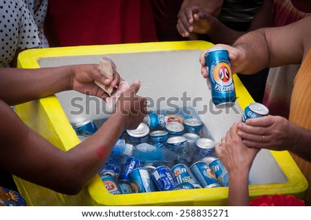 RIO DE JANEIRO, BRAZIL - FEBRUARY 14, 2015: Man selling beer in the street during Carnival. During big events street sellers make thousands of dollars within few days.