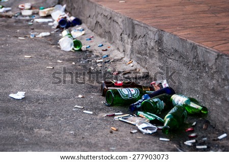 NOVA IGUACU, RIO DE JANEIRO, BRAZIL - 12 APRIL 2015: Streets full of trash after heavy saturday night partying in the city.