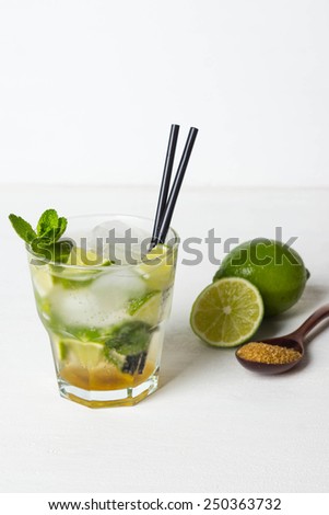 Fresh mojito drink on the white wooden table