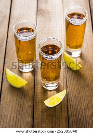 Tequila in shot glasses with lime and salt