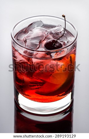Old fashioned cocktail dark background