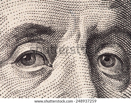 Benjamin Franklin eyes extreme macro on us 100 dollar bill, united states money closeup
