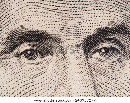 Abraham Lincoln eyes extreme macro on US 5 dollar bill, united states money closeup, 2003 series