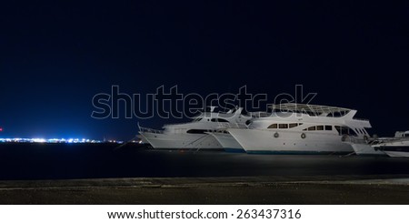 Diving safari yachts moored at night marina