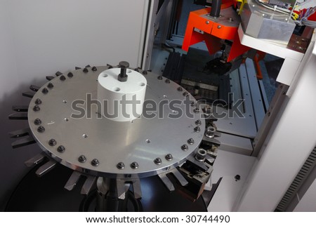 CNC machine with a mechanical arm and rotate tool changer