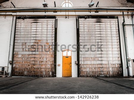 Between normal yellow two door shutter door