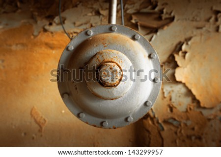 Gray industrial instrument on the wall