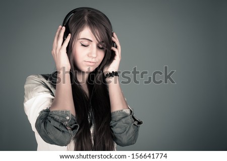 Young beautiful woman enjoying the music
