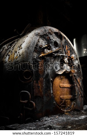 Old rusty industrial coal-fired boiler