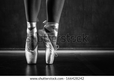 Young ballerina dancing, closeup on legs and shoes