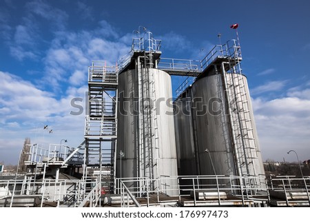 beer processing and storage silos against blue sky