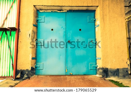 an old industrial building, a closed elevator door