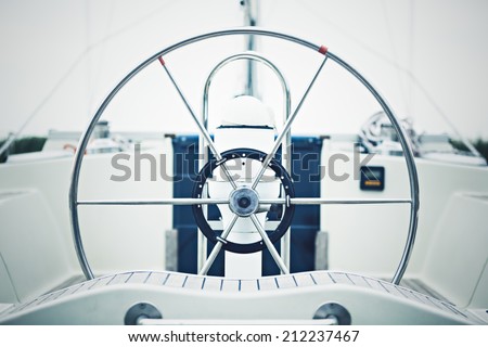 a modern sailing yacht steering wheels