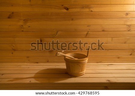sauna bucket in wooden sauna room