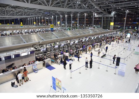 BANGKOK JANUARY 17. People waiting in check-in line G terminal of the Bangkok airport on January 17, 2012. Suvarnabhumi airport is world\'s 4th largest single-building airport terminal.