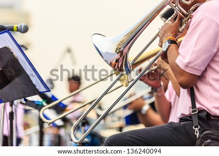 Musicians are playing on the  trumpet