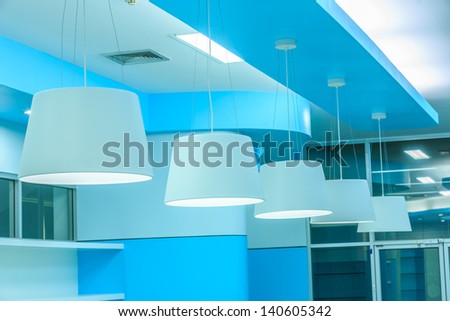 row of white ceiling lamp in library