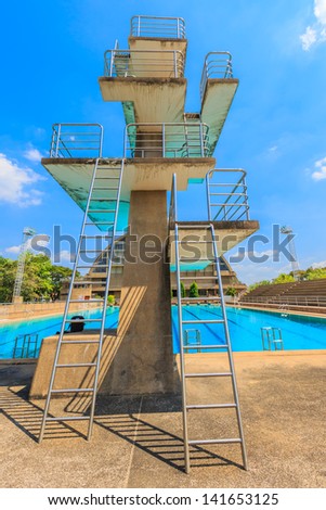 High diving board at a public swimming pool.