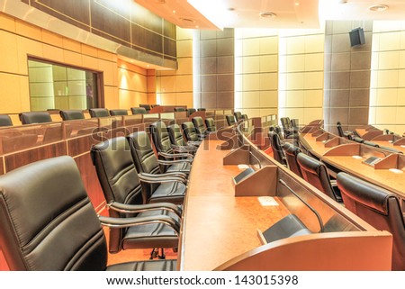 row of seats in empty conference room