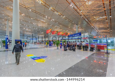 BEIJING JULE 30, Air Crew checking at immigration, Beijing airport  on June 30, 13 in Beijing . The airport has registered 488,495 annually aircraft movements and ranked 10th in the world.