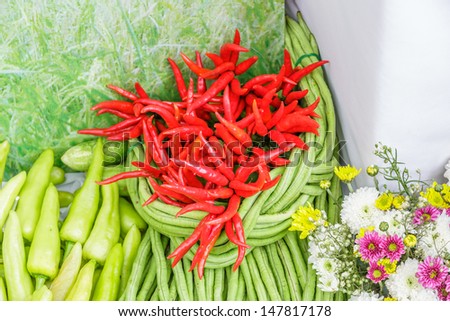 red and green chili with yardlong bean decorated with flower