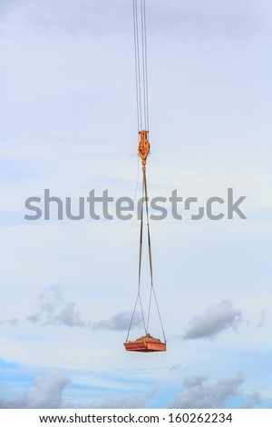 crane hook with soil in the board