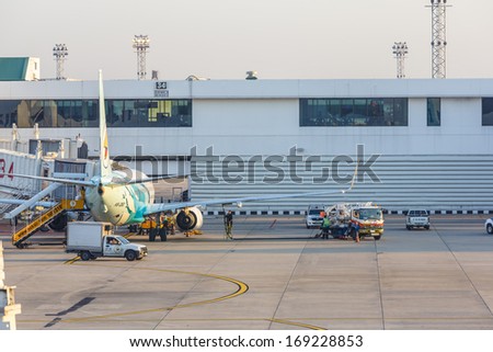 BANGKOK - DECEMBER 18: Nok Air flights  for servicing at Don Mueang International Airport on Dec 18, 13 in Bangkok. It is considered to be one of the worlds oldest international airports.