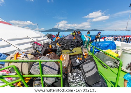 LANGAWI, MALAYSIA-DECEMBER 19: Luggages store on the ferry boat deck on Dec 19, 13 in Kuala Kedah, Malysia. Langkawi Ferry Services  operate fast A/C boats from Langkawi to Satul, Kedah and Penang.